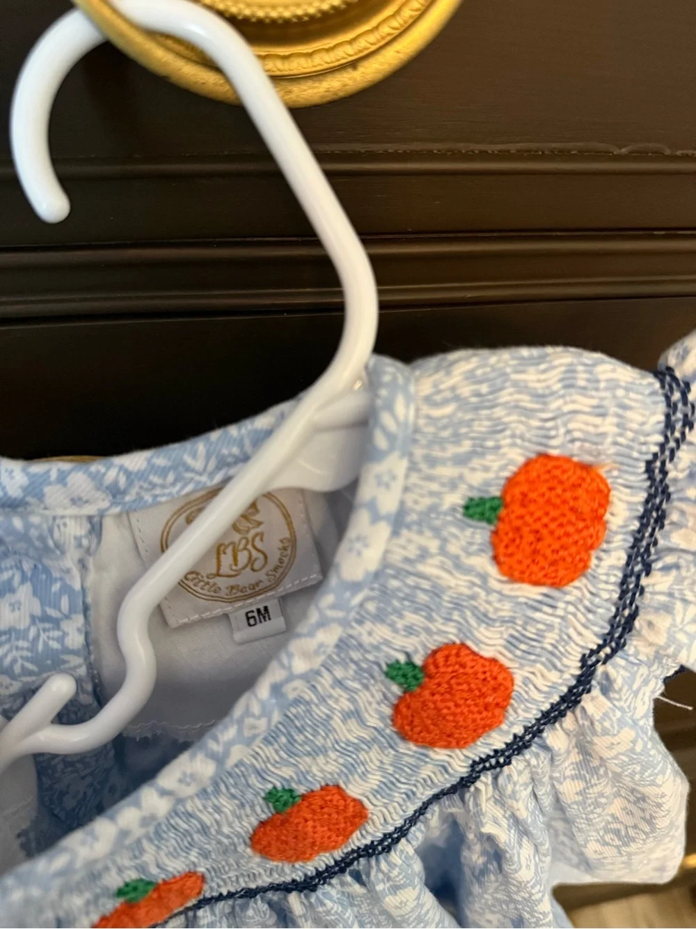 Smocked Blue Floral Baby Dress with Orange Pumpkin Motif